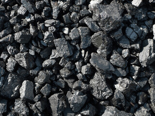 Barbecue grill coal close up. Black charcoal texture background