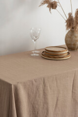 Home decor concept, table with beige tablecloth