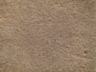 The brown concrete wall is a textured background. The stone tile has a brown texture. Concrete coating. Cement slab. Abstract concrete background