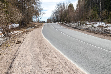 Narrow asphalt road between settlements in Karelia - obrazy, fototapety, plakaty