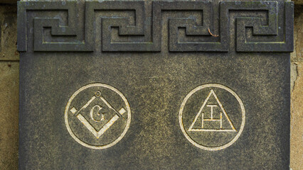 When a freemason dies often his colleagues would provide the headstone marked with symbols like the traditional square and compasses and triple tau of the Royal Arch Chapter