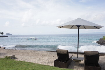 Beautiful beach. Chairs on the sandy beach near the sea. Summer holiday and vacation concept for tourism. Inspirational tropical landscape and tropical beach.