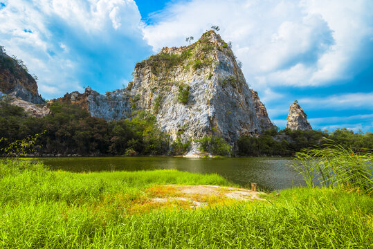 Limestone mountain and lake view at Mountain Snake Stone Park, or Khao Ngu Stone Park, tourist attraction in Ratchaburi province, Thailand
