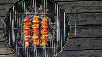 Grilled delicious red meat shashlik with italian tomato, pepper and onion in outdoor at home...