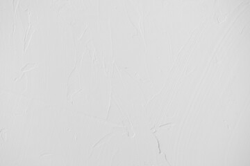 Neutral white colored low contrast Concrete textured background with roughness and irregularities to your concept or product.