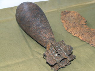 A rusty mortar shell from the Second World War. An artillery mine. Ammunition for firing mortars.
