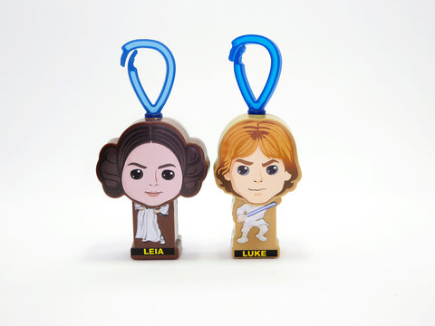  Princess Leia and Luke Skywalker.  Star Wars. Movie's characters. Toys. Small collectible toys. Saga. Isolated white. Good guys. Darth Vader and clones. McDonald's happy meal collectible toy. Pilot.