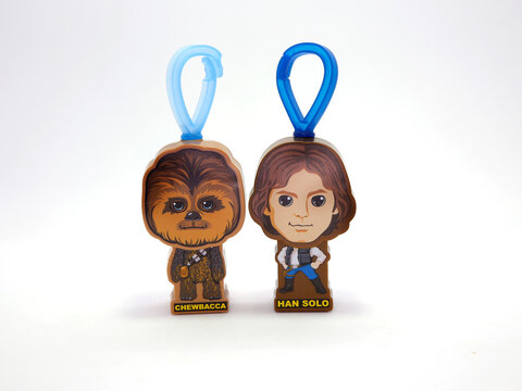 Star Wars. Movie's characters. Toys. Chewbacca and Han Solo. Small collectible toys. Saga. Isolated white. Good guys. Darth Vader and clones. McDonald's happy meal collectible toy.