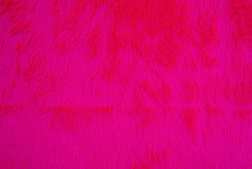 Fuchsia color artificial fur background. Copy space, space for text.  