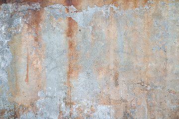 texture of old gray and rusty  grunge concrete wall with remains of plaster for urban background