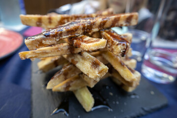 Fried breaded Eggplant tower with honey. Front view