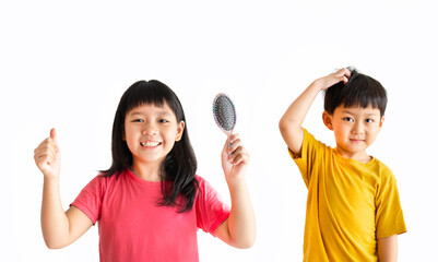 Conditioner shampoo hair.comb hair. Beauty salon.Asian sibling child black hairs holding wet comb and boy itch allergy.Child hairstyle hold hairbrush comb before shampoo.Healthy skincare.sibling asian - obrazy, fototapety, plakaty