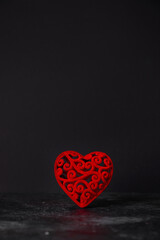 Red heart on a black background. Valentine's day concept.