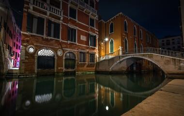 Venice, bridge over canal at night 
