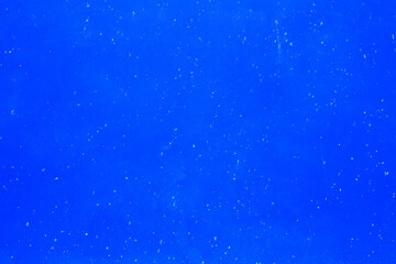 Closeup of a completely blue wall ideal for textures and patterns