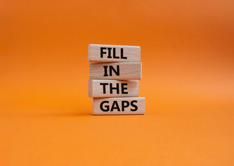 Fill in the gaps symbol. Concept words fill in the gaps on wooden blocks. Beautiful orange...
