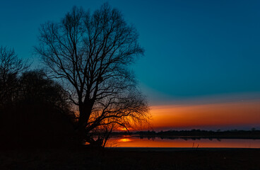 Obraz na płótnie Canvas Beautiful sunset with reflections near Mettenufer, Danube, Bavaria, Germany