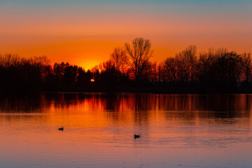 Beautiful sunset with reflections near Plattling, Isar, Bavaria, Germany