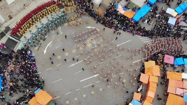 Aerial Top View Of A Dancing Procession And Audience During A Carnival In Oruro, Bolivia