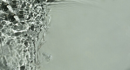 Surface texture with splashes and bubbles. Abstract nature background. Cosmetic moisturizer water. 
