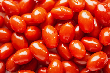 Red long tomatoes, top view. Food background