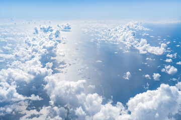 Aerial view of sea and clouds on a sunny day