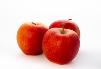 Fresh red apples isolated on white background. Environmentally friendly product.