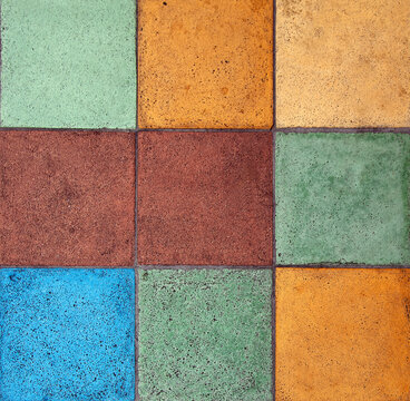 Colorful pastel tiles in square grid pattern.