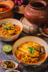 Khao Soi Kai,Delicious northern Thai food,Arranged with seasonings on the table.