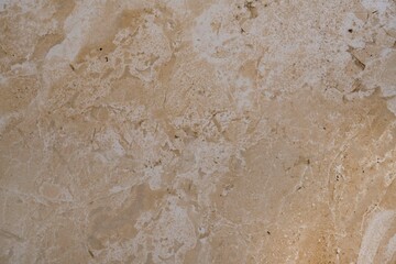 Background of polished stone, light brown granite