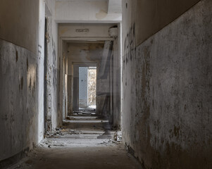 Obraz premium Ghost of man in an abandoned building. Silhouette in abandoned building. Ghost in corridor.
