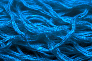 Blue threads of wool close up. Texture of woolen threads for knitting.