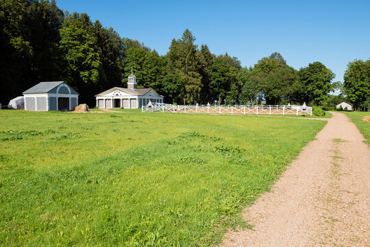 Wooden corral for horse dressage in the countryside on a sunny day. Paddock on farmland with wooden fence