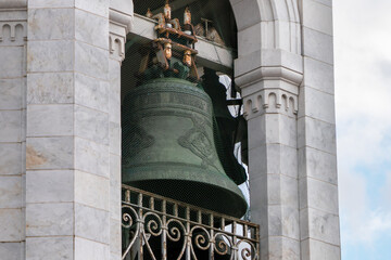 Orthodox Russian Christian green bell decorated with Old Russian inscriptions. Close up.