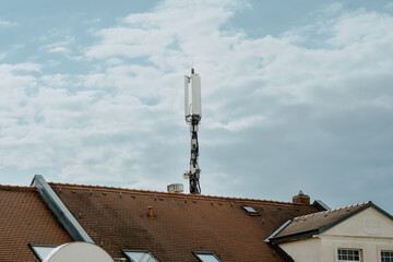 LTE and 5G antenna for cellular on a roof with blue sky