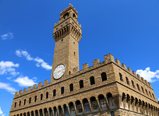 Fototapeta na wymiar Tower of the Old Palace called PALAZZO VECCHIO in Italian langauge Florence city in Italy in Europe