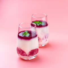 Dessert of cream and red oranges in a glass