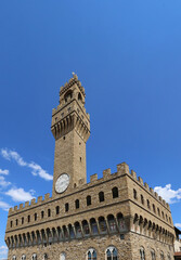 Obraz premium TOWER OF OLD PALACE called Palazzo Vecchio in Italian language in Florence City in Italy in Tuscany Region in Europe and blue sky