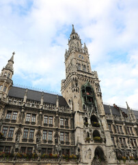 tower with clock and carillon of the new town hall in Munich in Germany seen from below
