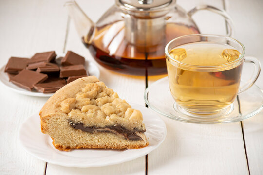 Piece of shortbread pie with chocolate filling and tea