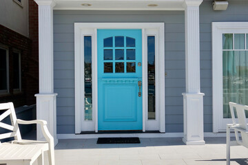 modern beach cottage with aqua blue front door