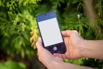 Hand holding phone and takes photos with blank screen