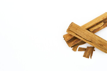 cinnamon sticks isolated on white with left margin