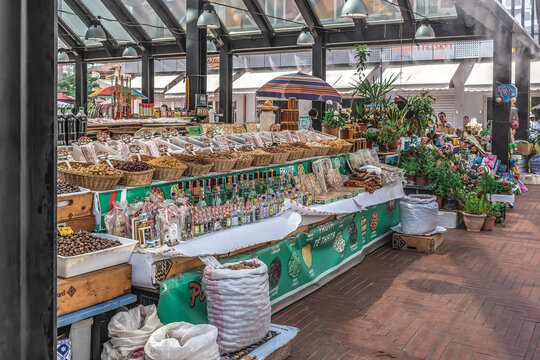 Tirana, Albania - June 21, 2021: A stall with dried fruits and oils at the Pazari i Ri market in Tirana. Tourist open-air market in the center of the Albanian capital