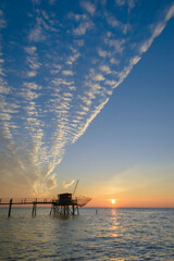 Wooden fishing hut at sunset on coast of La Rochelle, Charente Maritime, France