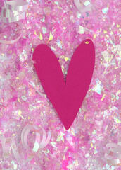 Pink Big Heart on a Iridescent Confetti Background. Simple Modern Composition with Paper Cut Love Symbol and Scattered Confetti ideal for Card, Wall Art, Poster. Top-Down View. No text.