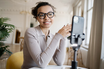 Video call the blogger uses the phone. Freelancer millennial chat online.