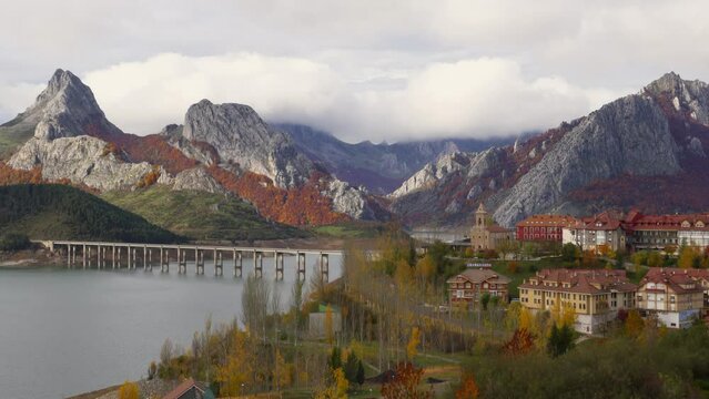 Riano cityscape at sunrise with mountain range in autumn in Picos de Europa National Park, Riano, Leon, Spain, Europe