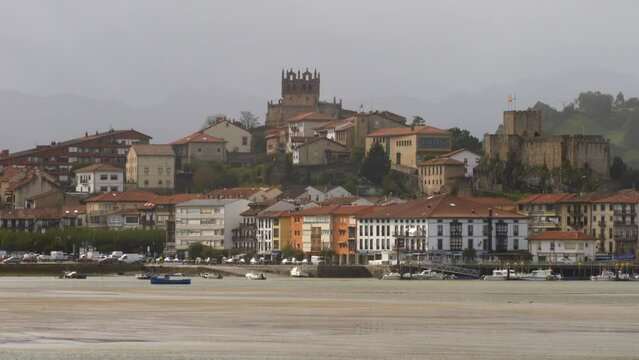 San Vicente de la Barquera view,the other side of Escudo River with mountains in the background, Cantabria, Spain, Europe