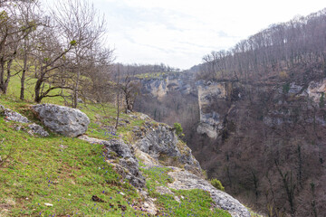 spring, sunrise in the mountains with a panoramic view from the canyon of the mountain river located on the tourist route.*